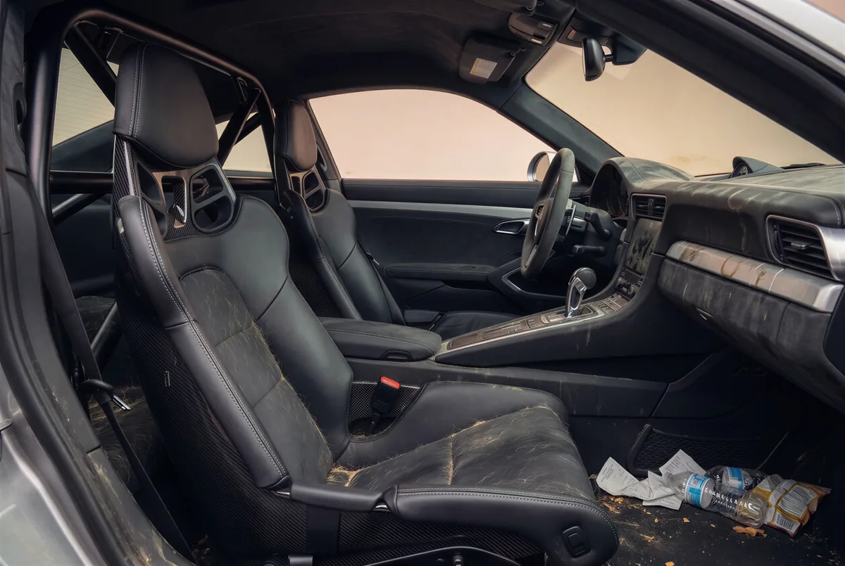 A messy interior with crumbs, hair and rubbish