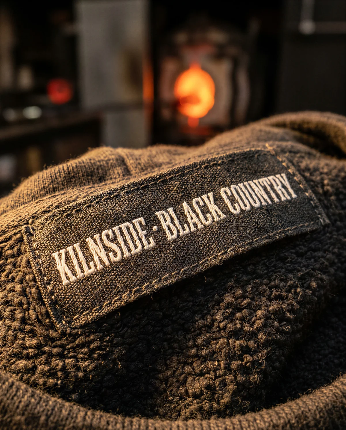 Close-up of a woven KILNSIDE Black Country neck label